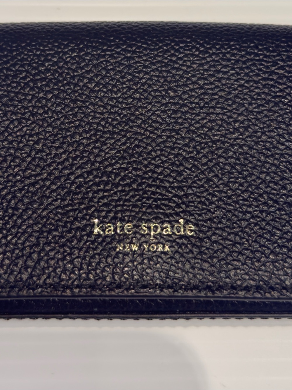 kate spade black pebbled leather wallet with gold logo